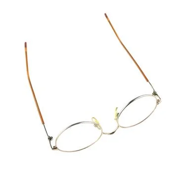 Old glasses for problem vision put upturned isolated Foto stock