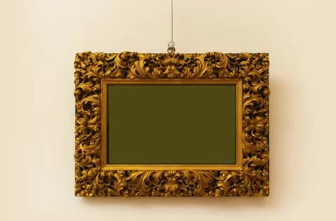Old gold frame on the wall Stock-Fotos