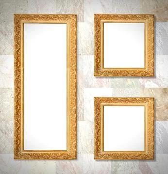 An old gold frames hanging on a marble wall, background Illustrazione stock