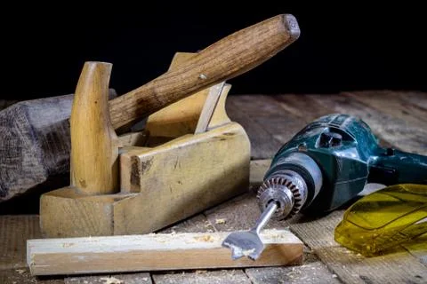 Old good carpentry, tools drill bit. Wooden carpentry table and old good carp Stock Photos