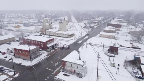 Old grain elevator and train station in small town of Michigan, winter Stock Footage 247604570
