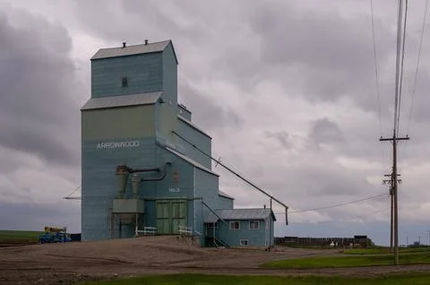Old grain elevator in the town of Arrowwood Alberta. Stock Photos