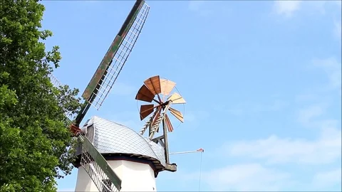 Old grain mill against blue sky Stock Footage 80934188