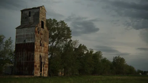 Old grain mill in an early spring pastoral setting at magic hour Stock Footage 199722561