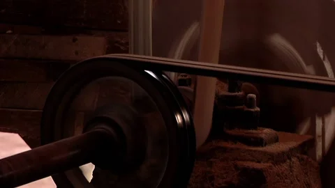 Old Grain Mill Machine with Rotating Pulley and Belt in Rural Workshop  Stock Footage 153761816