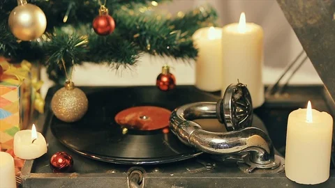 An old gramophone playing under a decorated Christmas tree Stock Footage 95410908