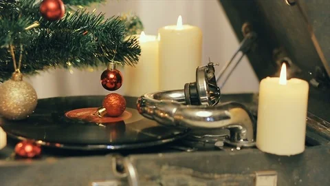 An old gramophone playing under a decorated Christmas tree Stock Footage 95465977