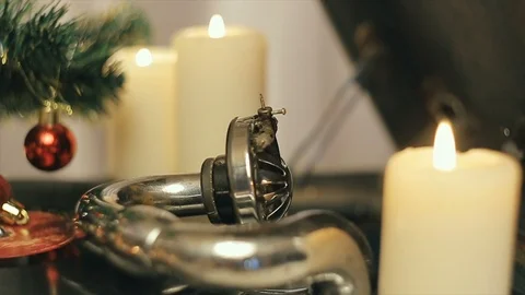 An old gramophone playing under a decorated Christmas tree Stock Footage 95466462