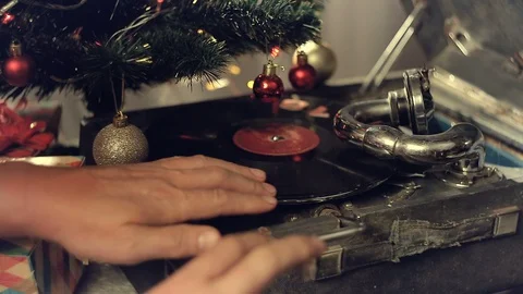An old gramophone playing under a decorated Christmas tree Stock Footage 95679990