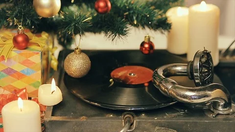 An old gramophone playing under a decorated Christmas tree Stock Footage 112351792