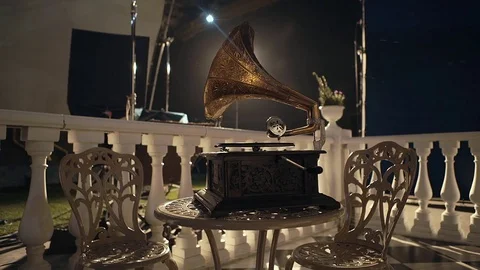 Old gramophone playing vinyl disc in the background Stock Footage 74063385