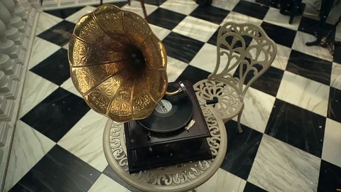 Old gramophone playing vinyl disc in the background Stock Footage 74063733
