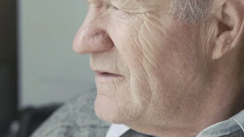 Old grandfather looking at the window Video stock 69756112