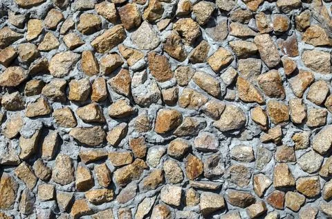 Old granite wall of small stone fragments Stock-Fotos