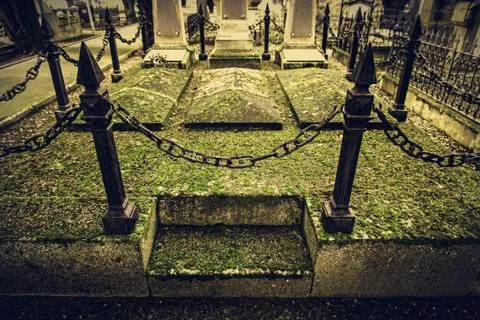 Old graves in a cemetery Stock Photos