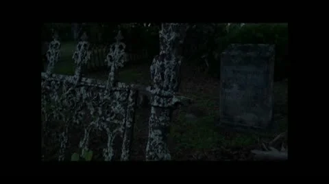 Old Graveyard Gate with a Tombstone in the background Stockbeeldmateriaal 11625500