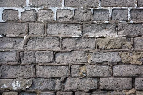 Old gray brick wall background or texture, close up. Foto stock