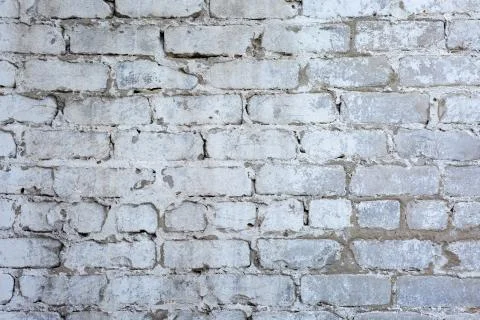 Old gray brick wall background or texture, close up. Stock Photos