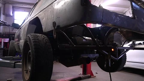 Old gray car after a road accident, performs welding work Video stock 297687404