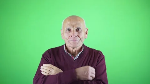 Old gray haired bald man take off dust from sweater Stock Footage 164916551