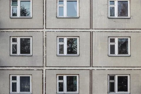 The old gray panel house. Texture and background Stock Photos