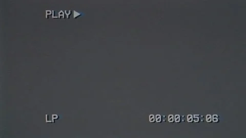 Old gray screen with PLAY text and timecode. VHS glitches and static noise Stock Footage 153756020