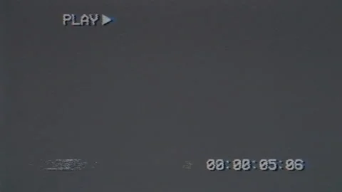 Old gray screen with PLAY text and timecode. VHS glitches and static noise Video stock 204940904