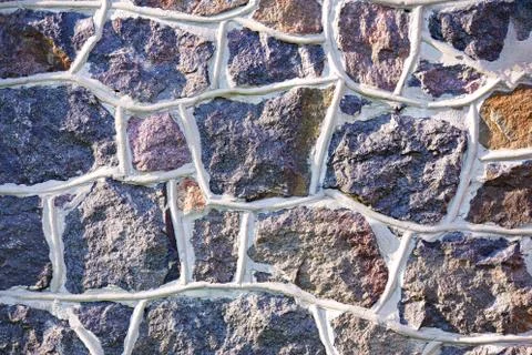Old gray stone wall rustic texture background. Stock Photos