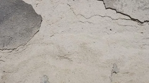 Old gray wall with cracks Stock Photos