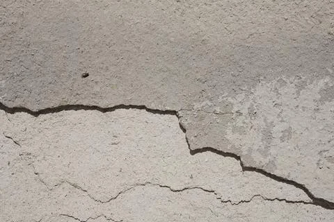 Old gray wall with cracks Stock Photos
