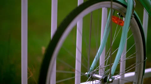 Old Green Bicycle Standing Beside Fence - Color Graded 4K Resolution Stock Footage 59854783