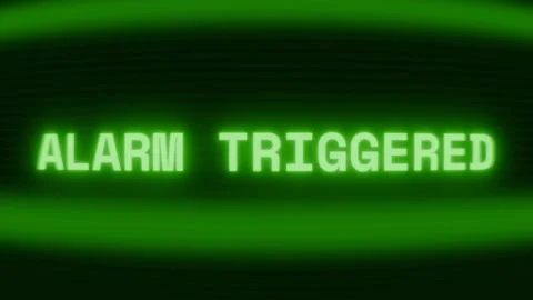 Old green CRT screen showing text ALARM TRIGGERED appearing in random glitch and Stock Footage 318280614