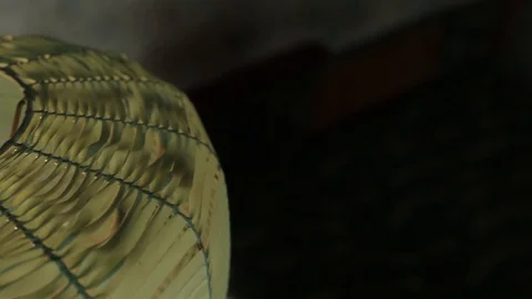 The old green floor lamp covered with a film shines in a vintage apartment Stock Footage 93848874