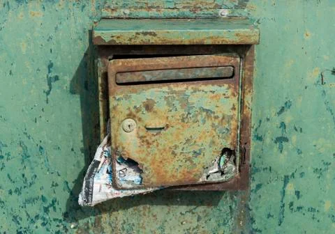 Old green mailbox with mail Stock Photos