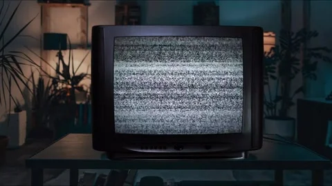 An old green screen TV or television flickers mockup displays glitch effect Stock Footage 344728039