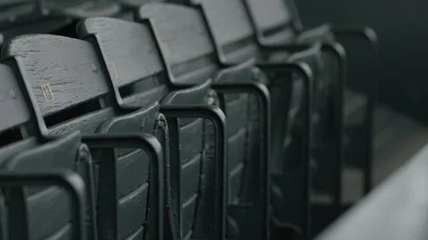 Old green seats in a stadium Stock Footage 106590061