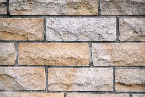Old grey brick wall texture background. Civil and industrial construction. Stock Photos