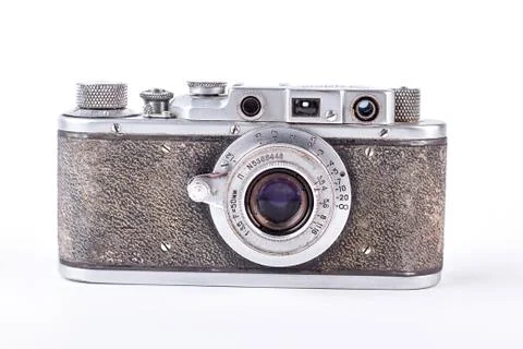 Old grey camera on white background. Stock Photos