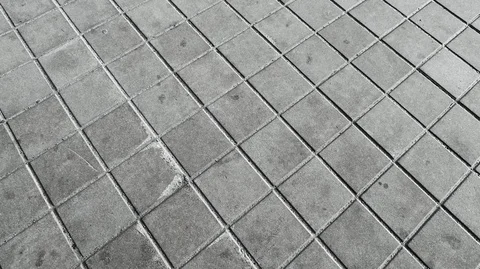 Old grey square paving tile Stock Footage 126171374