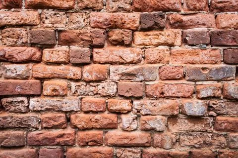 Old grunge brick wall background. Close up Stock Photos
