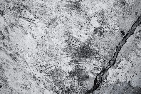 Old grunge dirty textured cement wall surface. With uneven stains and tiny ho Foto stock