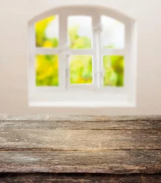Old grunge table below a sunny kitchen window Stock Photos