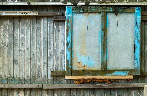 Old grungy closed Window Shutter Wall of Cabin. Stock Photos