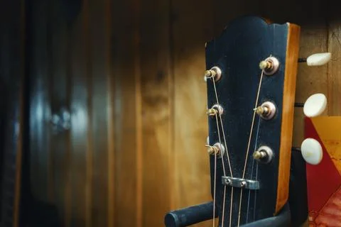 Old Guitar on the Wall Stock Photos