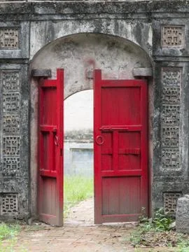 Old half opened red door Stock Photos