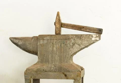 Old hammer and anvil tools. Stock Photos