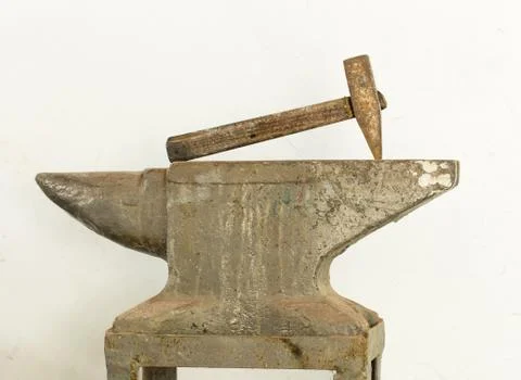 Old hammer and anvil tools. Stock Photos