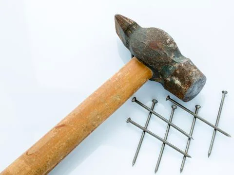 Old hammer and nails. Objects on a light background Foto stock