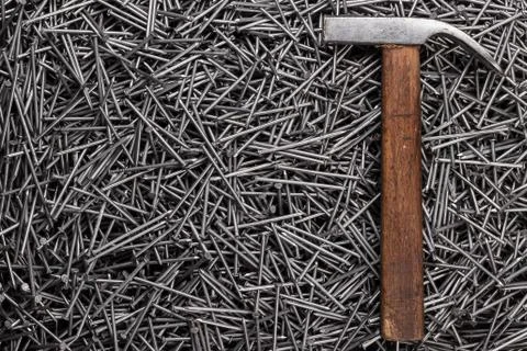 Old hammer and nails on table Stock Photos