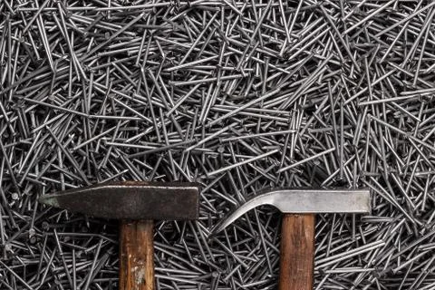 Old hammers and nails on table Stock Photos